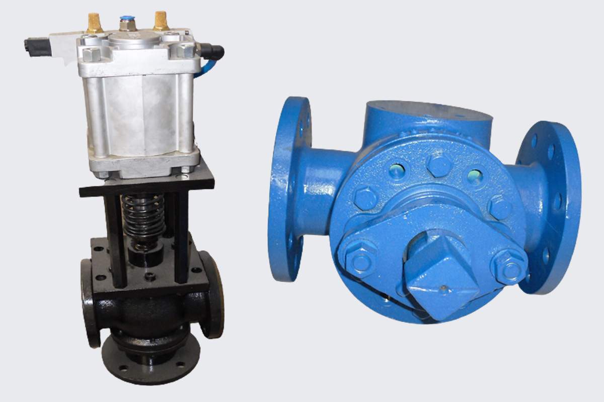 Actuated asphalt valve next to a blue flanged valve body
